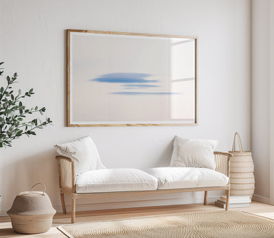 Cloud wall art by Cattie Coyle Photography above couch