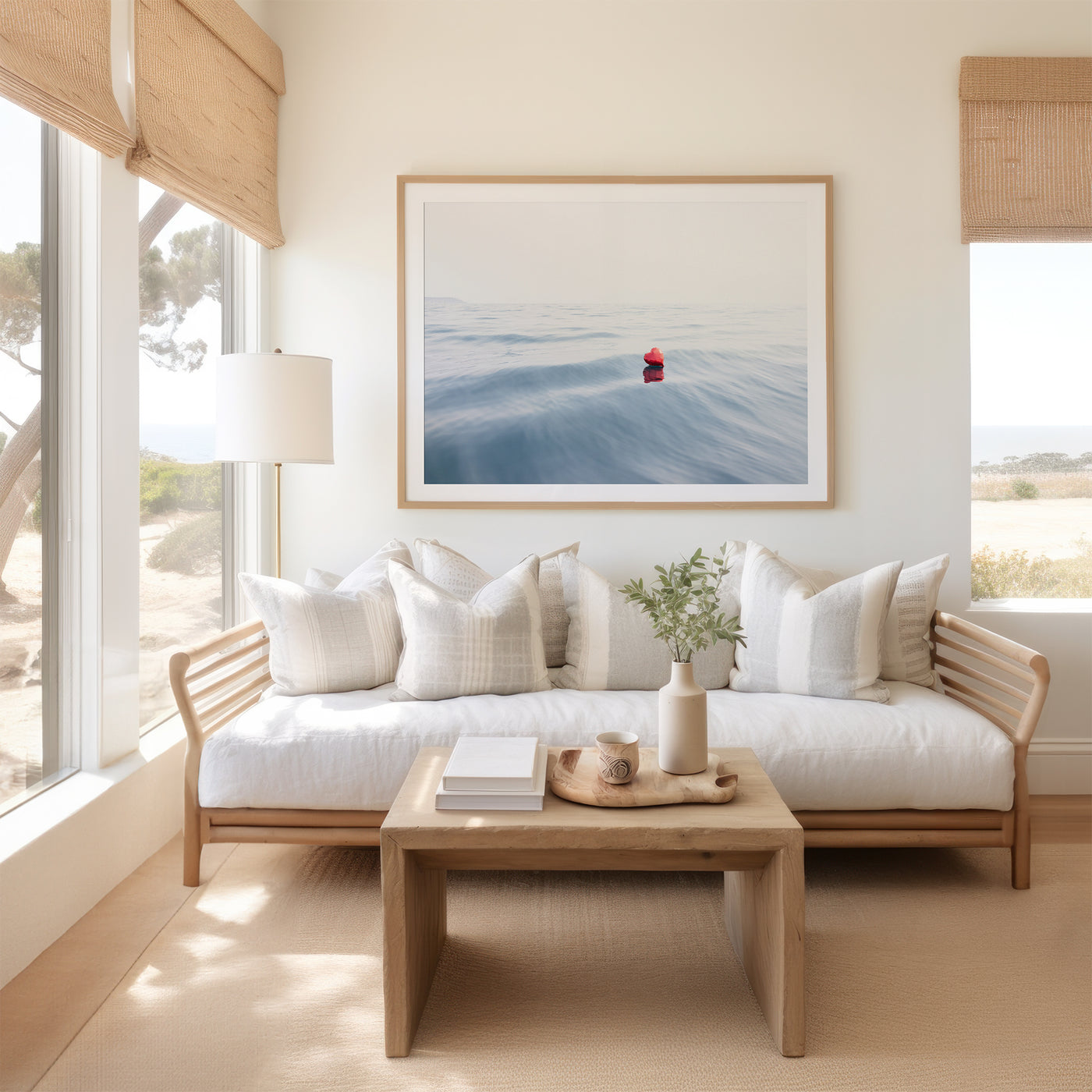 Heart art print by Cattie Coyle Photography above couch in coastal living room