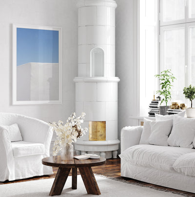 White and blue art print by Cattie Coyle Photography in living room